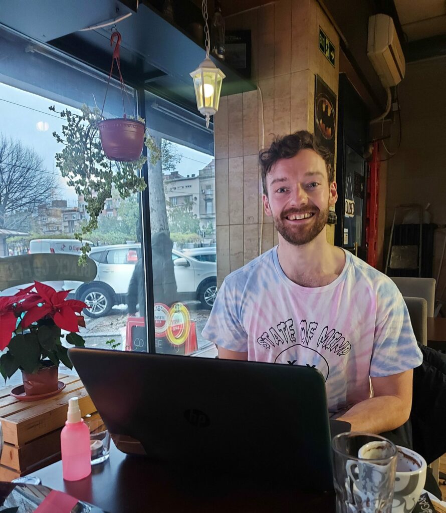 Me, freelance writing in a cafe in Belgrade, Serbia